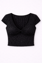 Black textured crop top on a white background