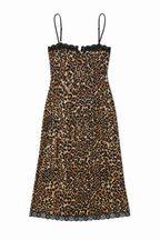 Leopard print dress with lace trim on a white background