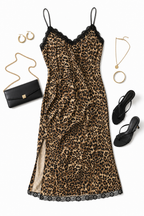 Leopard print dress with black clutch, shoes, and jewelry on a white background