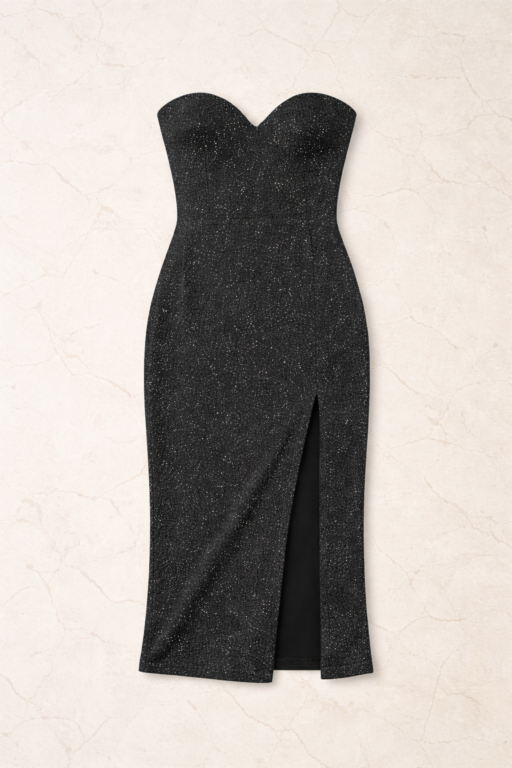 Black strapless dress with a slit on a beige background