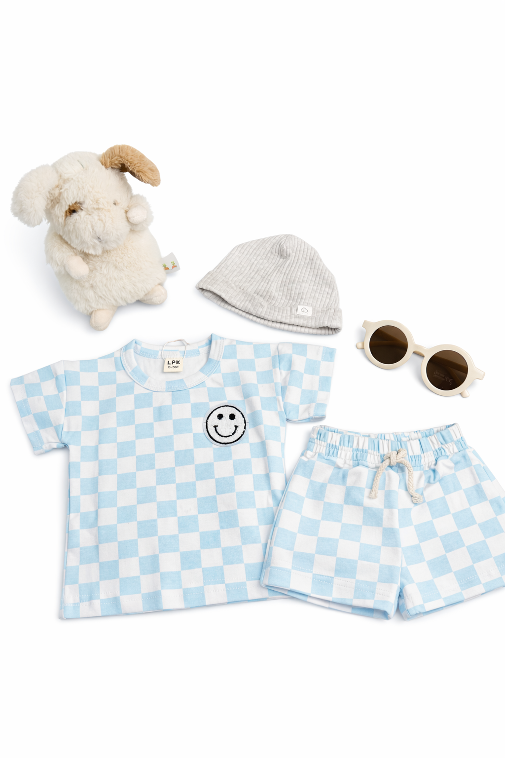 Children's blue and white checkered outfit with a smiley face shirt, shorts, hat, and toy on a white background