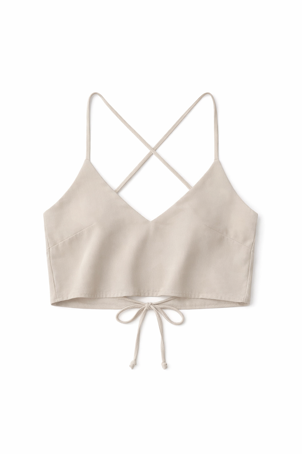 Beige crop top with criss-cross straps on a white background