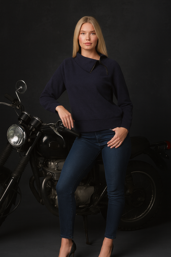 Woman wearing navy blue cowl-neck sweater with zipper detail, styled with jeans – Resamon women’s fashion