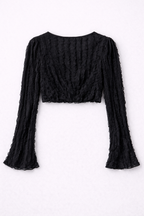 Black textured long-sleeve top on a white background