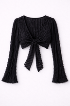 Black textured long-sleeve top with a knot detail on a white background